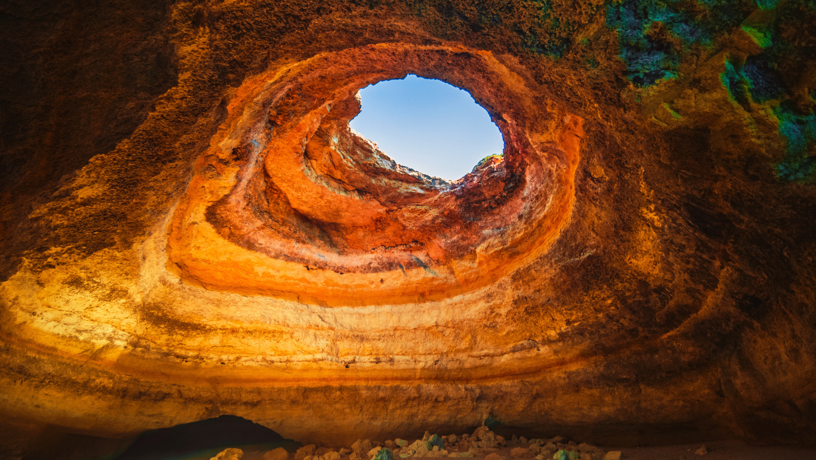 Colorful cave with natural skylight